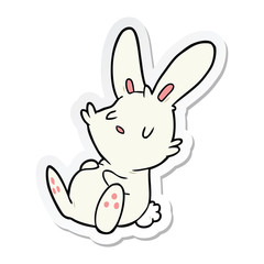 sticker of a cartoon rabbit sleeping