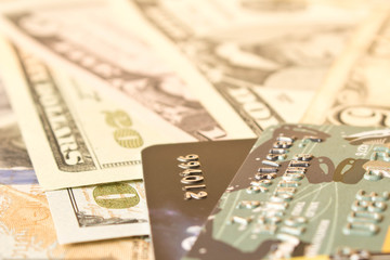 Credit cards and cash dollars. The concept of funding. Selective focus.