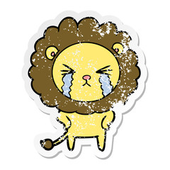 distressed sticker of a cartoon crying lion
