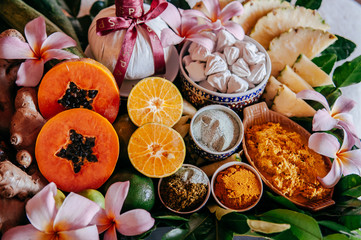 Thai spa ingredients with herbs and fresh tropical fruits