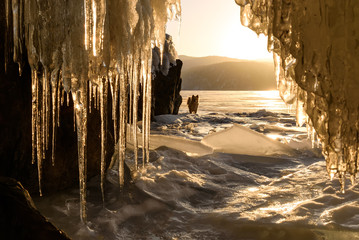 ice cave sun mountains sunrise icicles lake