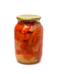 Marinated tomatoes in a glass jar on a white background.