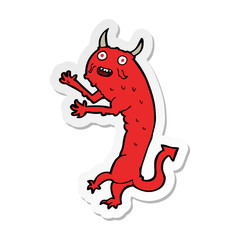 sticker of a cartoon devil