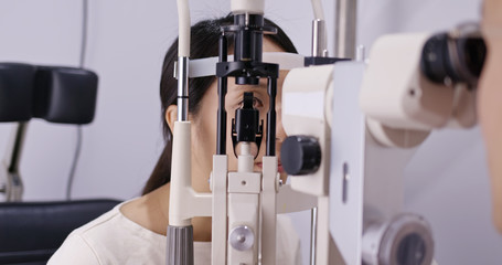 Woman check on eye at clinic