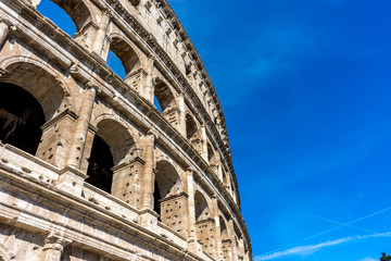 Facade of the Great Roman Colosseum (Coliseum, Colosseo), also known as the Flavian Amphitheatre. Famous world landmark