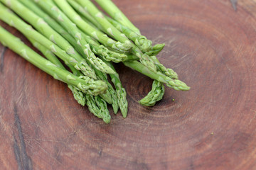 Raw asparagus. Fresh Asparagus on wooden background