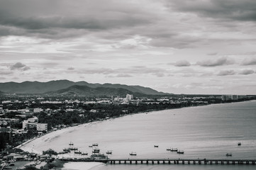 Famous Hua Hin beach and bay in evening with cityscape. Thailand coast