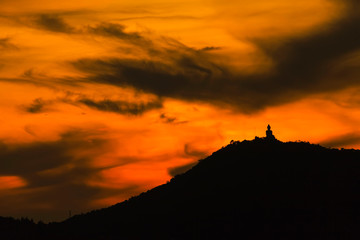 silhouette of big buddha at sunset