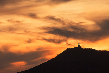 Fototapeta premium silhouette of big buddha at sunset