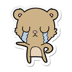 sticker of a crying cartoon bear