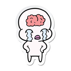 sticker of a cartoon big brain alien crying