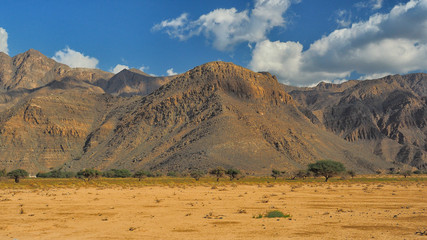 Fototapeta na wymiar Fantastic mountain landscape. Ru'us al Jibal. Al Hajar Moutains. Musandam. Oman