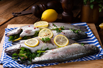 fresh trout with lemon and different herbs