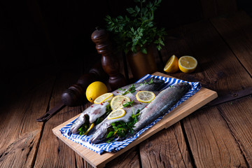 fresh trout with lemon and different herbs