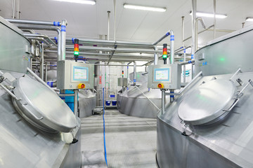 Dairy factory. Cheese food production. Tanks with raw product
