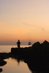 fishing at sunset