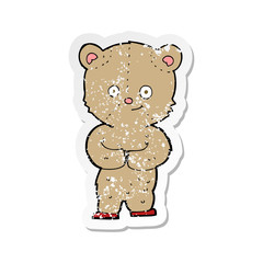 retro distressed sticker of a cartoon teddy bear