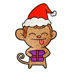 funny textured cartoon of a monkey with christmas present wearing santa hat