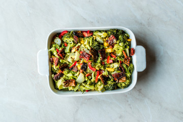Broccoli Salad with Dried Tomatoes, Yellow Pepper, Corn and Red Pepper Slices.