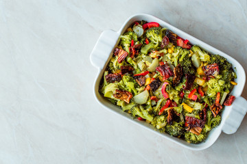 Broccoli Salad with Dried Tomatoes, Yellow Pepper, Corn and Red Pepper Slices.