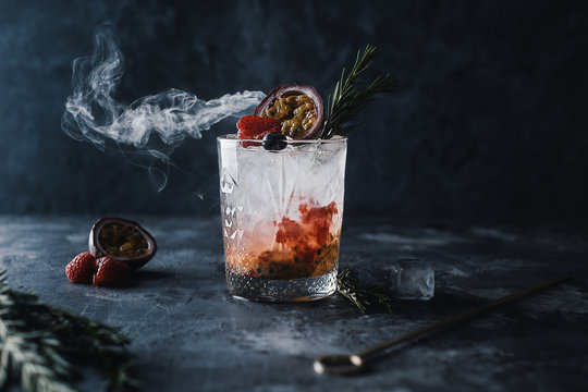 fresh Marakuya cocktail with juice, cold summer citrus refreshing drink or beverage with ice