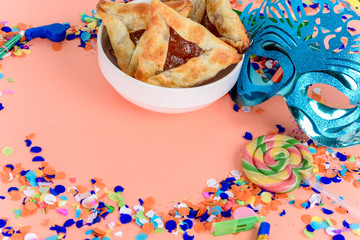 Purim with carnival mask, party costume and hamantasc