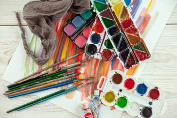 Paint brushes and paints for drawing.