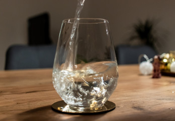 pouring water in a glass
