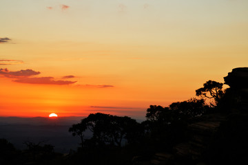 Stone profile and trees silhouettes at sunrise in Brazil