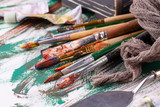 Paint brushes and paints for drawing.