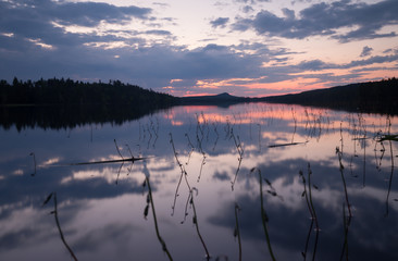 Beautiful sunset over a calm lake in summertime