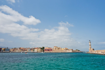 Fototapeta na wymiar Panoramic view of the old venetian harbor with a lighthouse at Chania, island of Crete, Greece