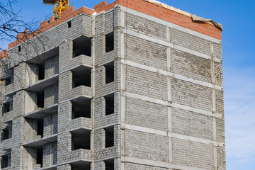 Building construction, start of construction against the blue sky