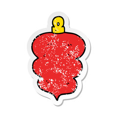 distressed sticker of a cartoon christmas bauble