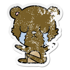distressed sticker of a crying cartoon bear