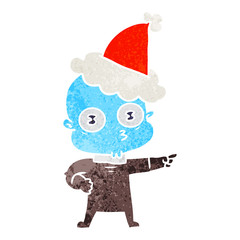 retro cartoon of a weird bald spaceman wearing santa hat