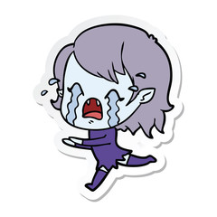 sticker of a cartoon crying vampire girl