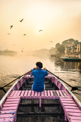 New Delhi, India - November 5 2017 : sunrise at the ghats of Yamuna river with  little boat ride to feed the migratory seagulls - 253236944