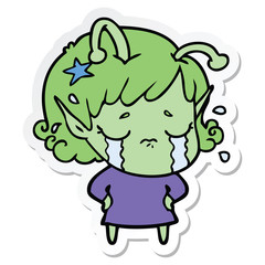 sticker of a cartoon crying alien girl