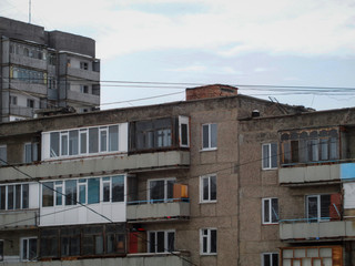 Fototapeta na wymiar Apartment buildings on the outskirts of the city of Ust-Kamenogorsk (Kazakhstan). Old multistory apartment buildings. Architectural background