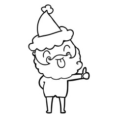 man with beard sticking out tongue wearing santa hat