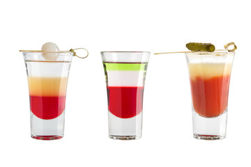 Popular alcohol shots on a white background. Three shots strong alcohol and decoration.