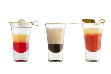Popular alcohol shots on a white background. Three shots and decoration.