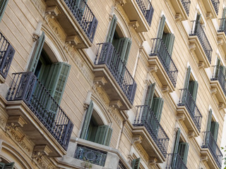 Fototapeta na wymiar Geometric shapes on the facade of a modernist residential building - Barcelona, Catalonia, Spain