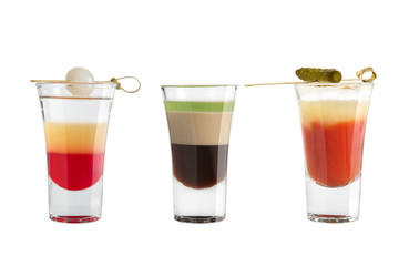 Popular alcohol shots on a white background. Three shots with decoration.