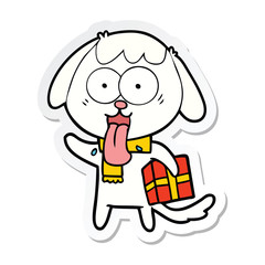sticker of a cute cartoon dog with christmas present