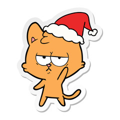 bored sticker cartoon of a cat wearing santa hat