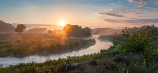 Fototapeta na wymiar Panorama with river on foggy sunrise