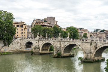 Obraz premium Italy, Rome, Tiber, a large bridge over some water with Tiber in the background