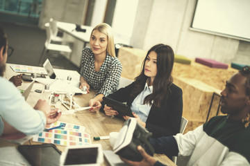 multiethnic business team learning about drone technology